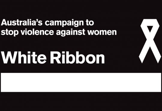 On a black background next to an image of a white folded ribbon, white texts reads ''Australia's campaign to stop violence against women' with the words 'White Ribbon' underneath