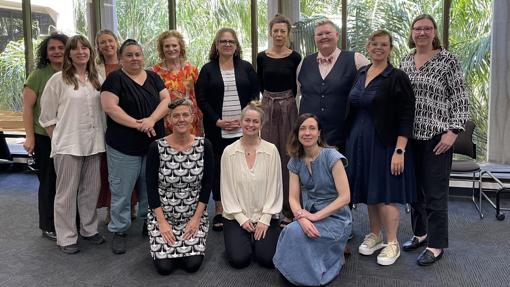 A group of people posing at a national alliance meeting in Adelaide